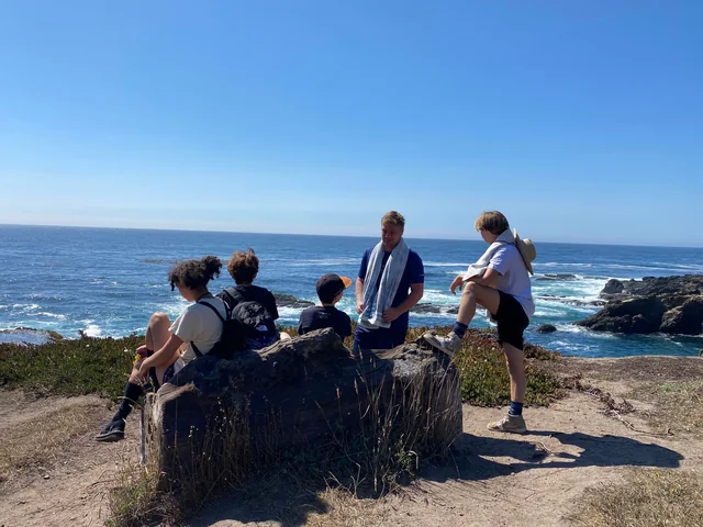 Campers looking out at the coast